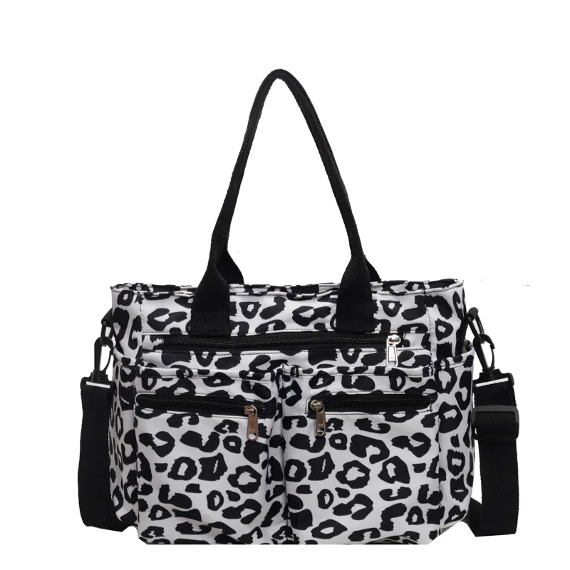 Sac de sport léopard unisexe blanc en nylon et polyester – dimensions 26 cm × 37 cm × 16 cm, avec compartiments